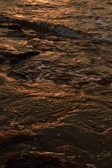 Abstract gradient texture of sunset reflection in the sea water
