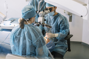 attractive doctor dentist operating