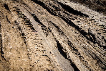 Deep car rut on a dirt road