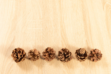 pine cones on wooden background