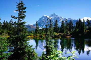 Autumn landscape of snow mountain and lake in Mt. Baker Hwy, Deming, USA