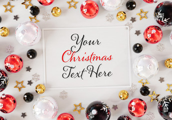 Christmas Card On White Surface  With  Ornaments Mockup