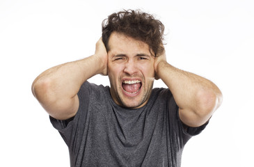 Screaming handsome young adult wearing t-shirt