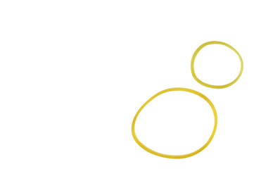 Yellow elastic rubber band on white background with a copy space. It can use for multiple purpose ex. hold papers and envelopes together, binding things together, hair tie, bag sealer
