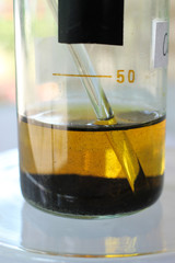 The process of precipitation of small crystals of iodine at the bottom of a beaker.