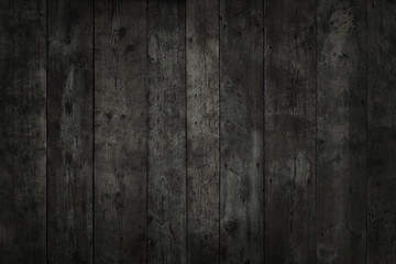 Stained, vertical boards. Black texture of wood.