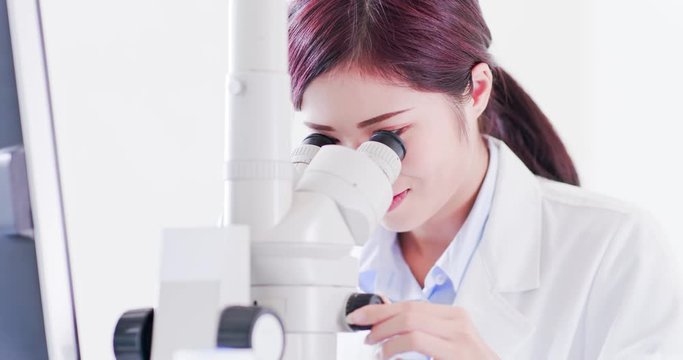 woman scientist use microscope