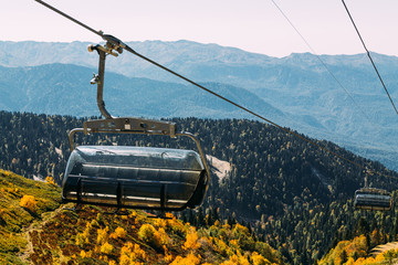 Funicular high in the mountains above the autumn forest