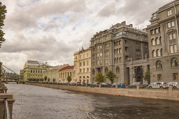 Fototapeta na wymiar Ancient historical buildings standing along the Kryukov canal embankment.Saint-Petersburg.