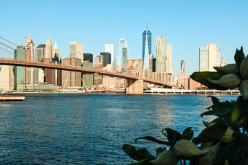 View of Brooklyn Bridge and Manhattan skyline at the early morning sun light - New York City...