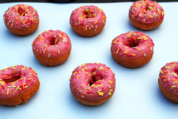 donut donuts sprinkles on doughnuts pink bright sugar strands background