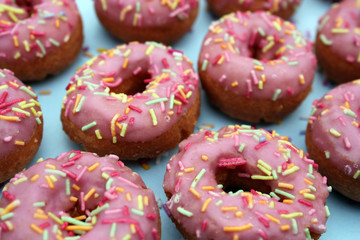 donut donuts sprinkles on doughnuts pink bright sugar strands background