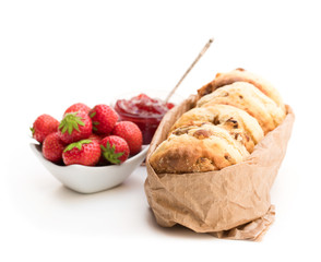 Traditional  scones with fresh strawberries and jam isolated on white