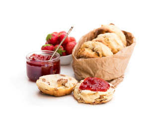 Traditional  scones with fresh strawberries and jam isolated on white