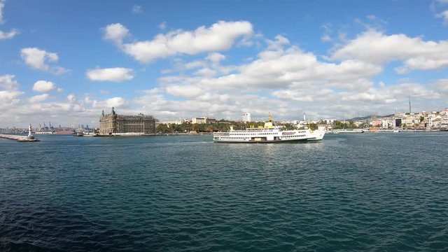 istanbul, Turkey - October 2018: Haydarpasa railway station with a ferry sailing infront. The building is being restored after a roof fire
