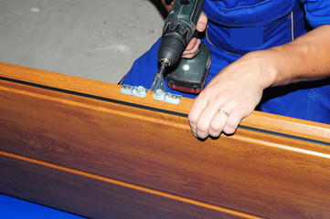 Garage door panel. Constractor repair and installig garage door board.