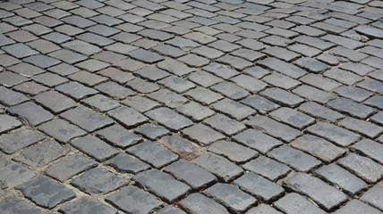 Old street pavers textured background. Path paving panoramic surface.