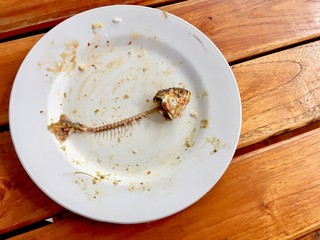 Fish bone (mackerel) on dirty dish