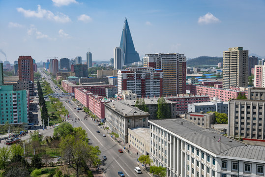 Fototapeta Pyongyang city scape, skyline of Pyongyang in North Korea, capital of DPRK (Democratic people's republic of Korea), road, cars and skyscrapers