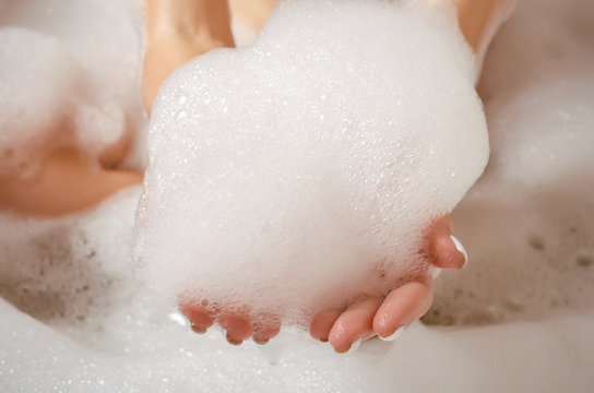 Beautiful woman in bath foam beauty health care body water