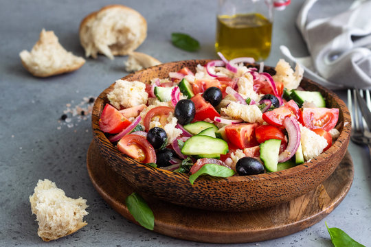 Panzanella, traditional Italian bread, tomato and basil salad. Summer healthy food. Copy space.