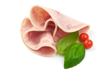 Sliced boiled ham sausage with basil leaves, isolated on a white background, close-up