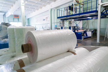 rolls of polyethylene or polypropylene film in a warehouse