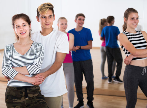Positive teenagers having dancing class