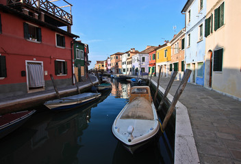 Fototapeta na wymiar Old boats on the canal of Burano island