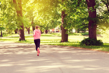 Fototapeta premium Fitness woman training and jogging in summer park