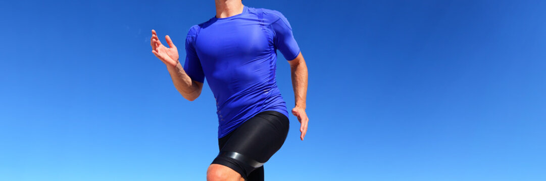 Sport Runner Male Athlete Running In Compression Sportswear Clothing Outdoor On Blue Background. Panoramic Banner Of Man On Run Race.