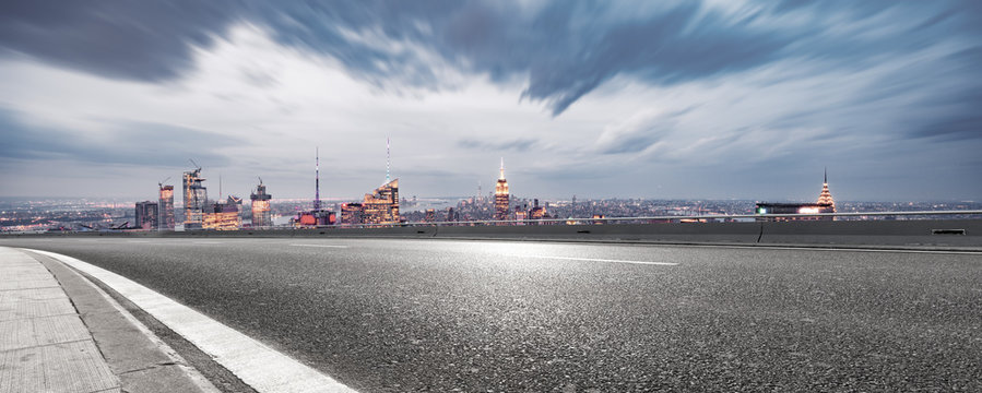 empty asphalt highway with modern cityscape new york