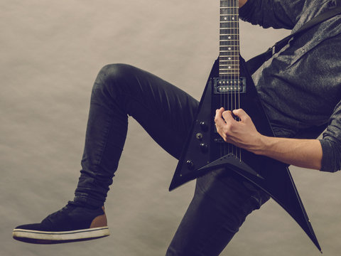 Man playing on electric guitar