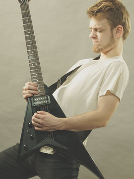 Man playing on electric guitar
