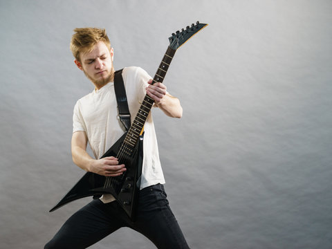 Man playing on electric guitar