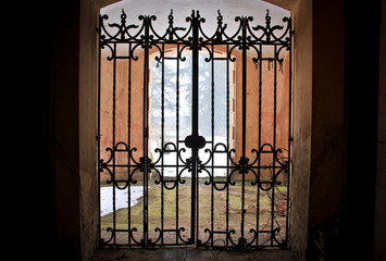 Gate with lattice in an abandoned castle in the Czech Republic