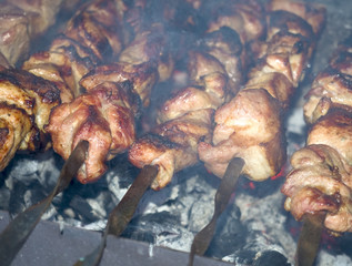 Yummy pork meat cooked outdoor on smouldering carbons