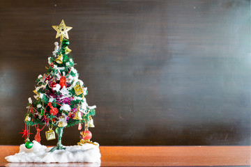 christmas tree and Christmas decorations on chalkboard background with 