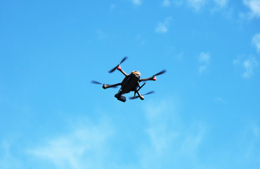 Unmanned aerial vehicle in the sky. Space for text.