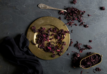 Dry hibiscus flowers on a dark background