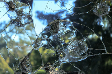 broken glass accident on the street / fancy patterns as a result of broken glass