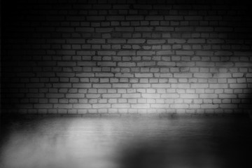 Background of empty dark room with concrete floor. Empty brick walls, neon light, smoke.