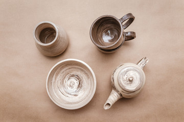 still life of the clay pottery teapot and cup and dishes