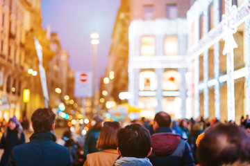 people crowd walking on busy street