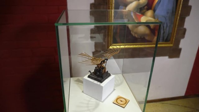 Flying machine showpiece antique model designed by Leonardo Da Vinci in a glass cube