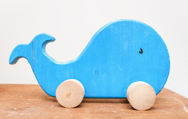 Wooden whale toy in child room