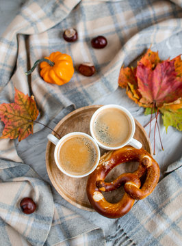 Tea Cup with Coffee Autumn Time Bakery Pretzel Toned Photo Knitting Scarf Blanket Yellow Leaves Gray Background