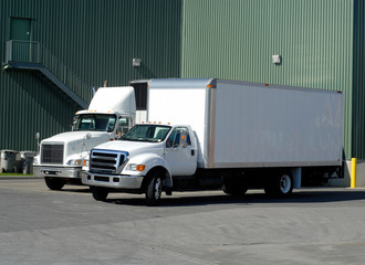 Two White Delivery Trucks No Logos