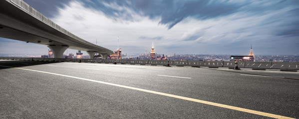 empty asphalt highway with modern cityscape new york