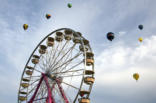 Ferris wheel with hot air balloons against blue sky /  Whimsical scene at a fair with balloons soaring above - nursery art